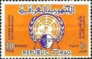 Scales of justice in front of the UN emblem