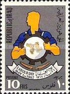 Emblem of the labour is held by worker