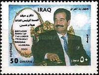 Saddam in a black suit