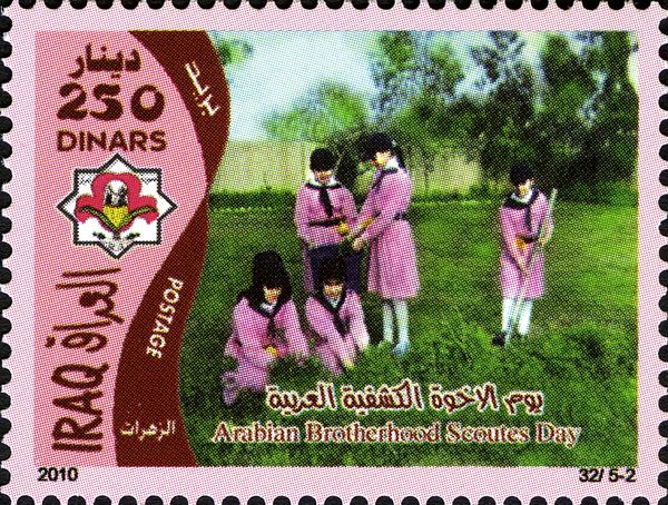 Girls raking cut grass