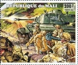 Soldiers Under Cover of British Tank