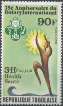 3-H emblem and man reaching for sun