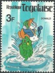 Donald Duck holding the snout of a crocodile