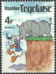 Donald dangling over the cliff edge from the horn of a Rhino