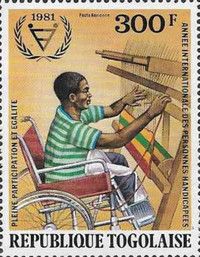 Disabled Man in Wheelchair Weaving