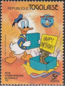 Donald opens a gift, Chip comes out with a 'Happy Birthday"