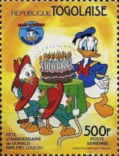 Huey, Dewey, Louie and Donald Duck with the birthday cake