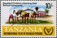 Disabled children cleaning their school compound