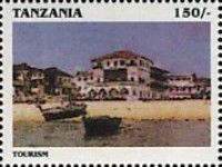 Buildings, boats along shore
