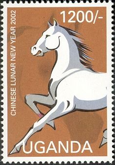White horse facing left