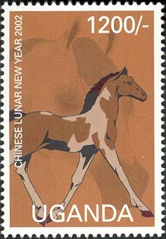 Tan and brown horse facing right, with two feet raised