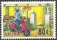 Mailman on motor scooter placing mail in mailbox