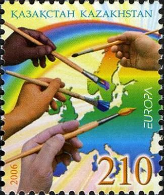 Hands of many Nations with Paintbrushes and Rainbow