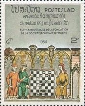 Woman teaching girls to play chess