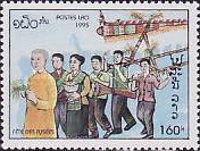 Carrying rocket in procession led by monk