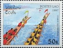 Team in red shirts, team in yellow shirts rowing upward