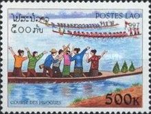 People standing in canoe cheering on teams