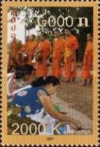 Women Kneel Before Buddhist Monks