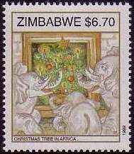 Elephants around Christmas tree