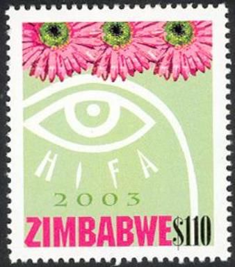 Eye logo and three pink daisies