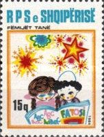 Children reading from a primer