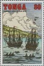 Sailing ships, natives in canoes