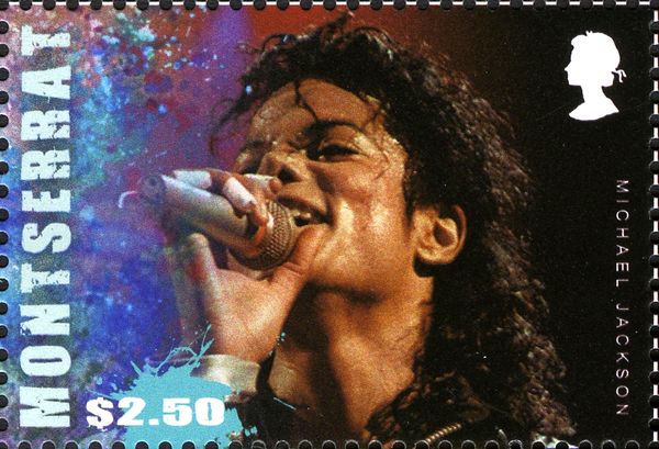Michael Jackson wearing Black Jacket and Holding Microphone