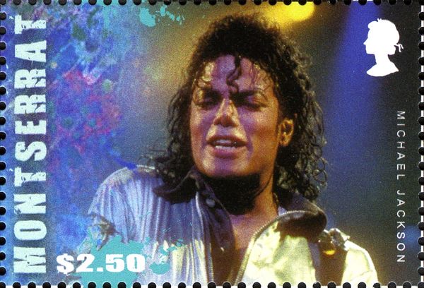 Michael Jackson Wearing Black Shirt and White Jacket