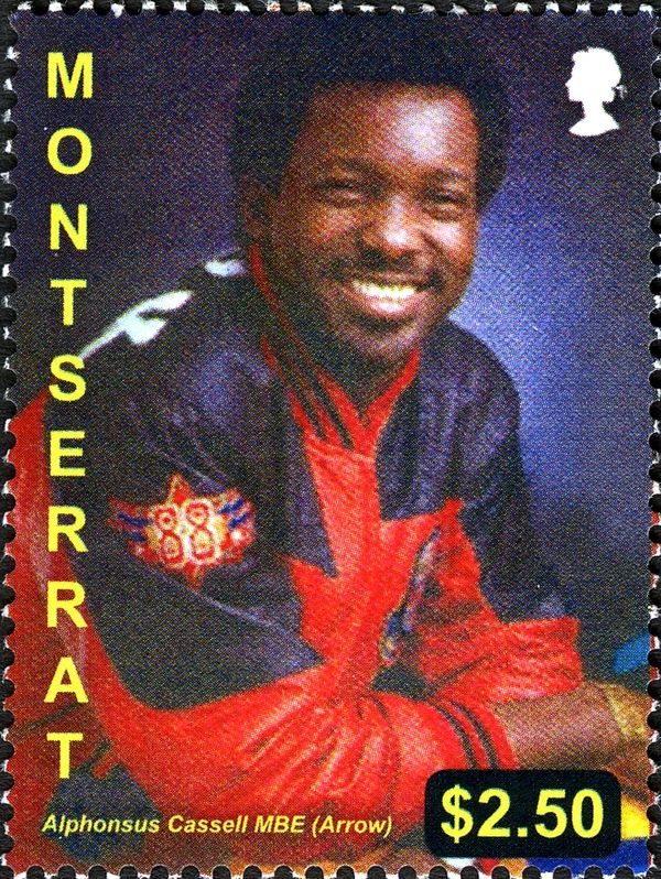 Alphonsus Cassell MBE wearing Red and Black Jacket
