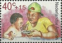 Boy Feeding Baby