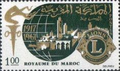 Torch, City Silhouette on Globe and Lions Emblem
