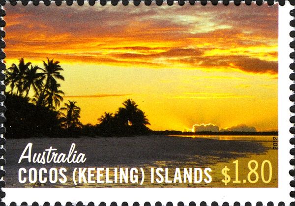 Sunset over Sandy Beach with Palm Trees