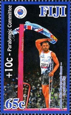Iliesa Delana Standing, Waving Fiji Flag