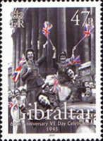 WAAF's waving Union Jacks in Car