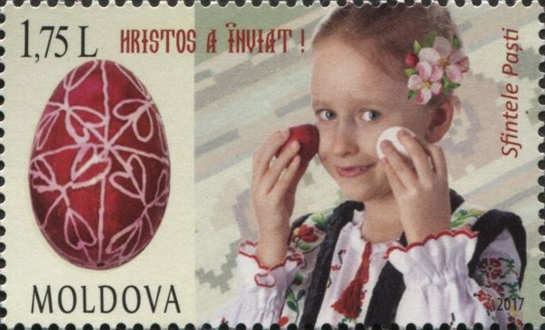Little Girl and Decorated Easter Eggs