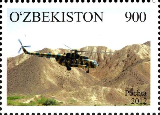 Combat Helicopter over Mountain Terrain