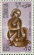 Woman Grinding Grain