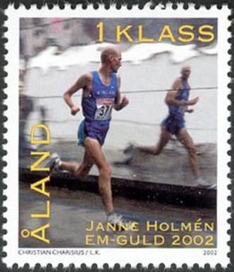 Janne Holmén runs past shop window