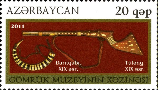 Rifle with Inlaid Stock and Powder Flask (XIX c.)