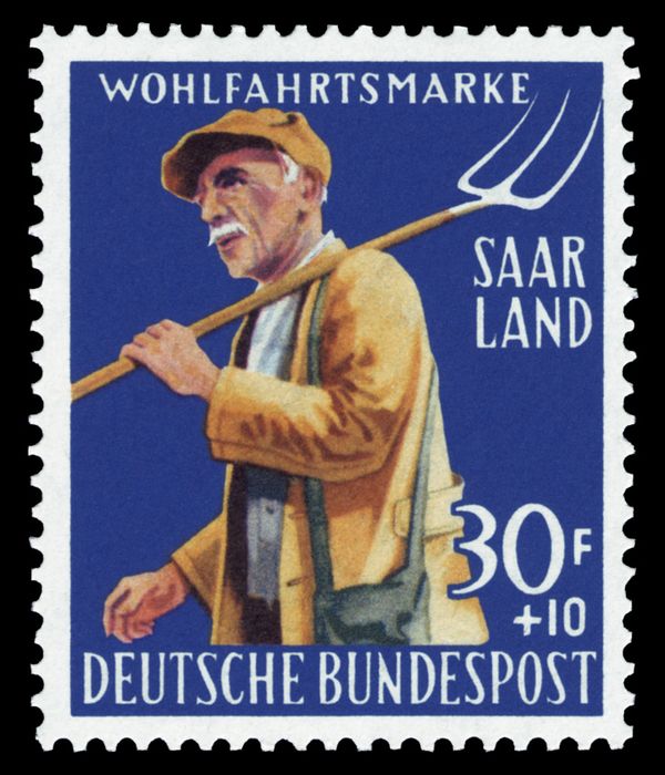 Farmer with hay-fork