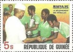 President Toure awarding medals